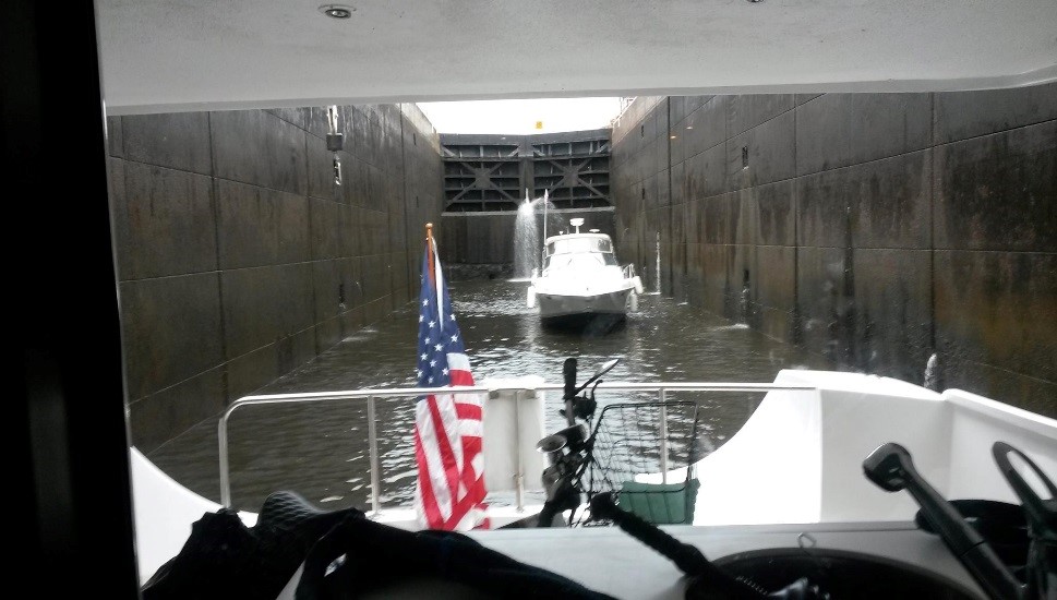 Donated 74 ft. yacht makes its way through Erie Canal locks.